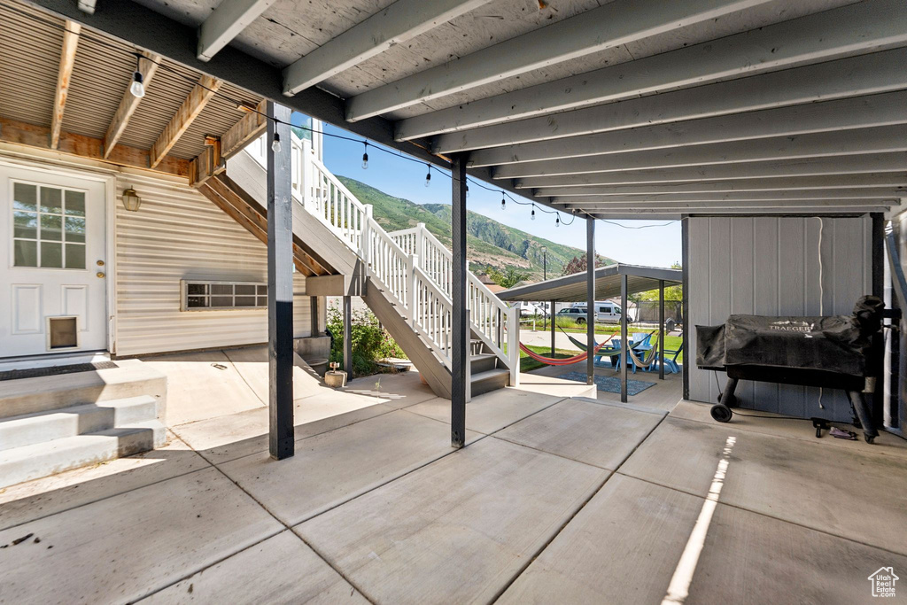 View of patio featuring stairway and a mountain view