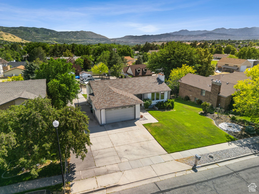 Aerial view of residential area with a mountainous background