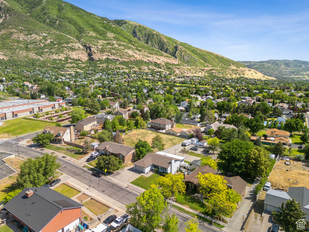 Aerial perspective of suburban area featuring a mountainous background