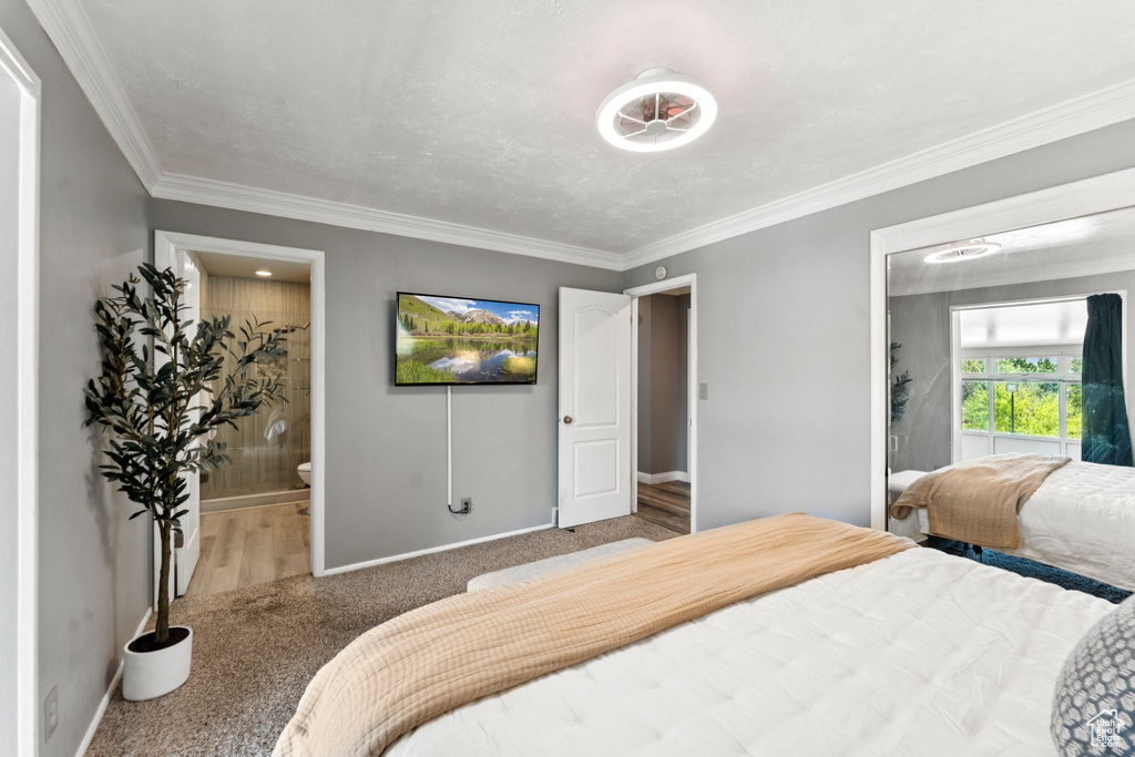 Bedroom featuring carpet flooring and ornamental molding