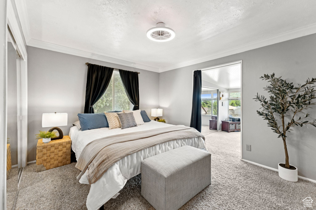 Bedroom featuring light carpet and ornamental molding