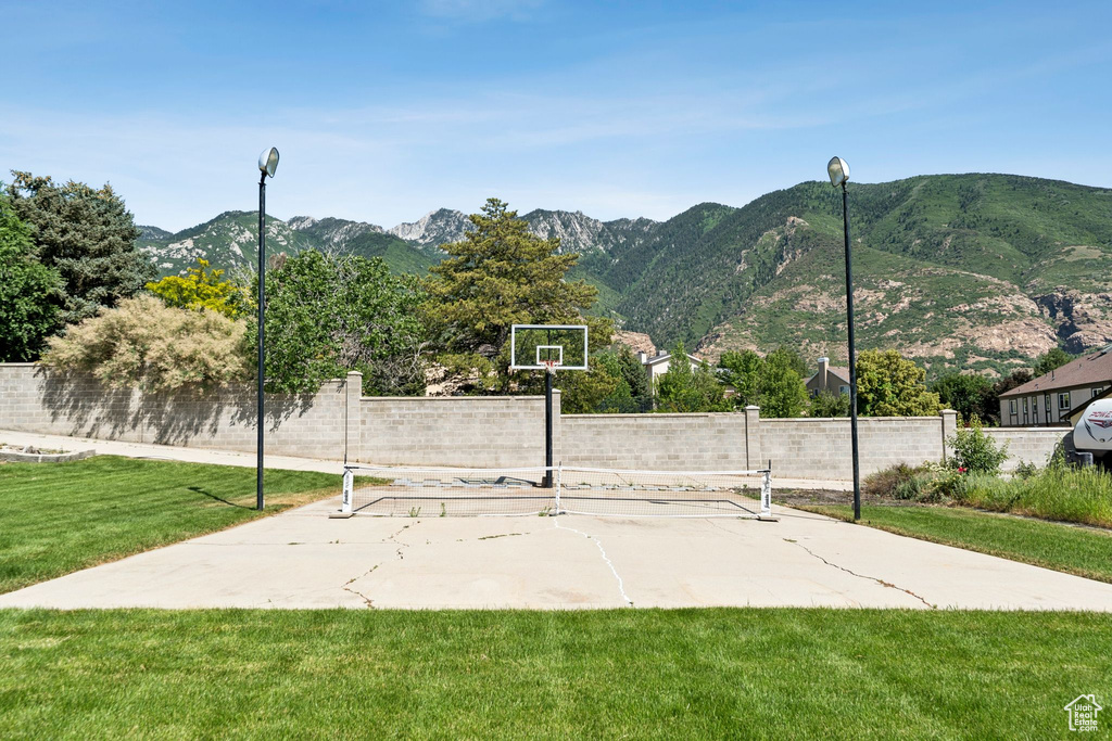 View of sport court with a mountain view and community basketball court