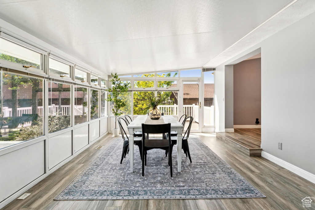 Sunroom featuring wood finished floors