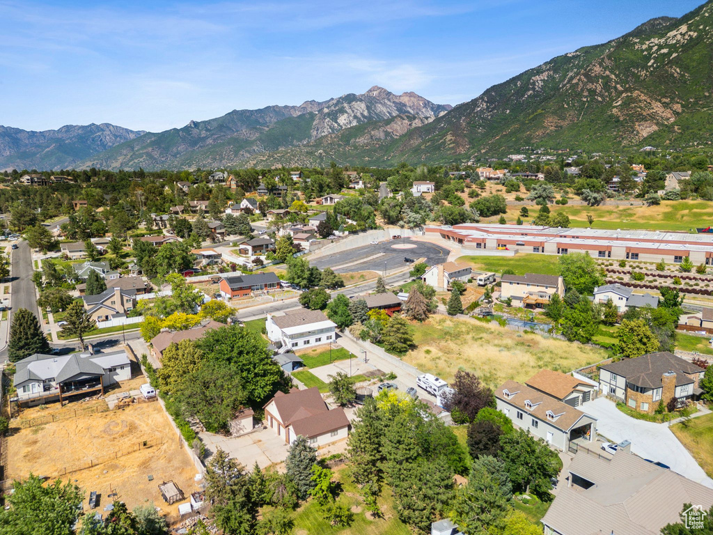 Aerial perspective of suburban area featuring a mountain backdrop