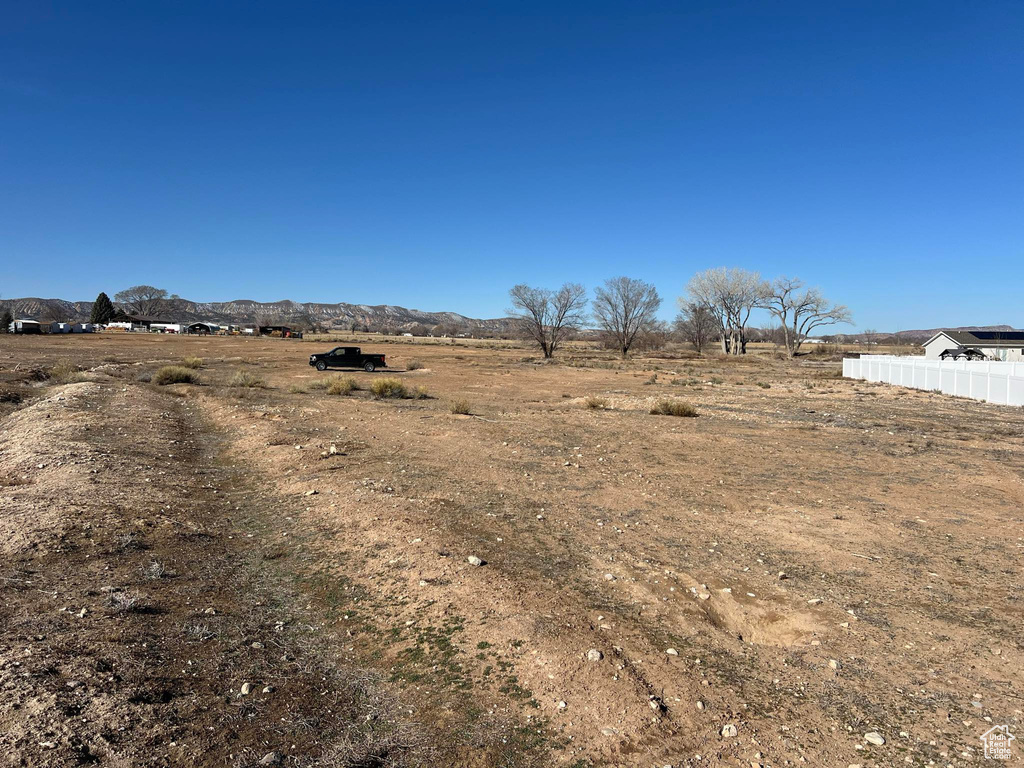 View of yard with a mountain view and a view of countryside