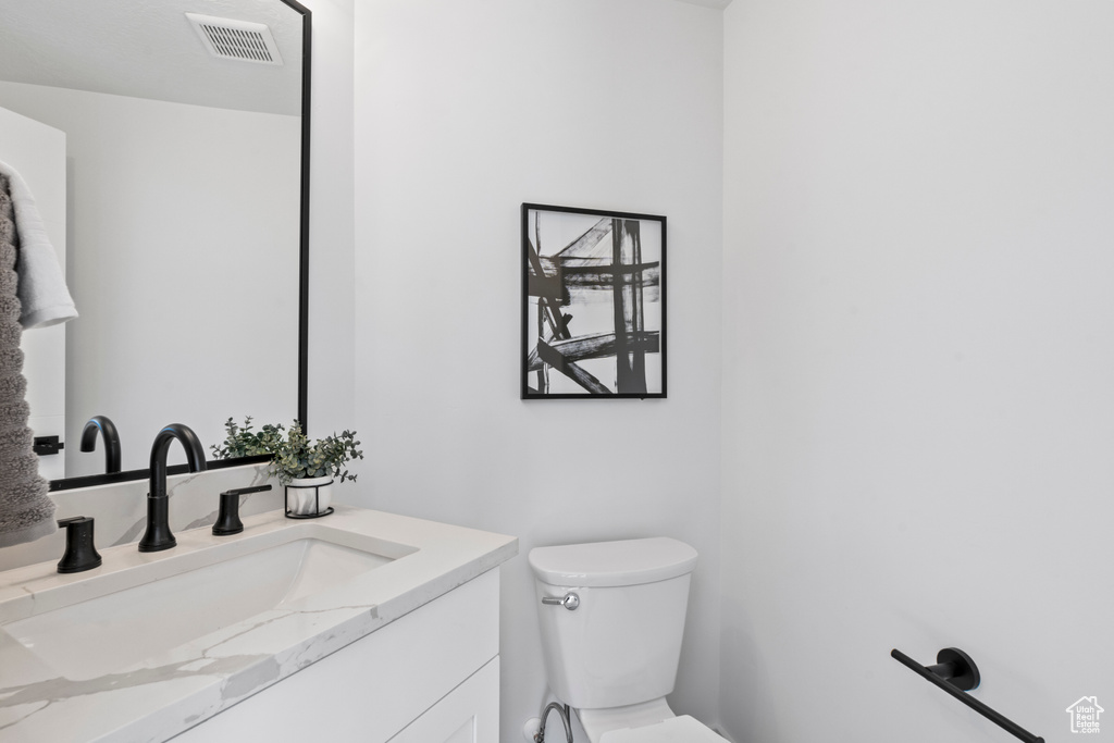 Bathroom featuring toilet and vanity