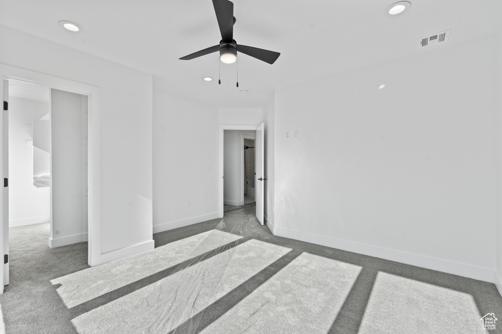 Empty room featuring carpet floors, recessed lighting, and ceiling fan