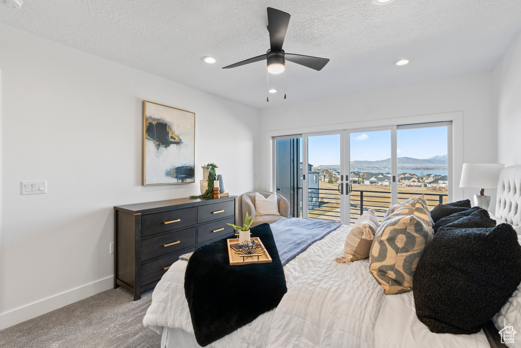 Bedroom with access to outside, light colored carpet, recessed lighting, a textured ceiling, and a ceiling fan