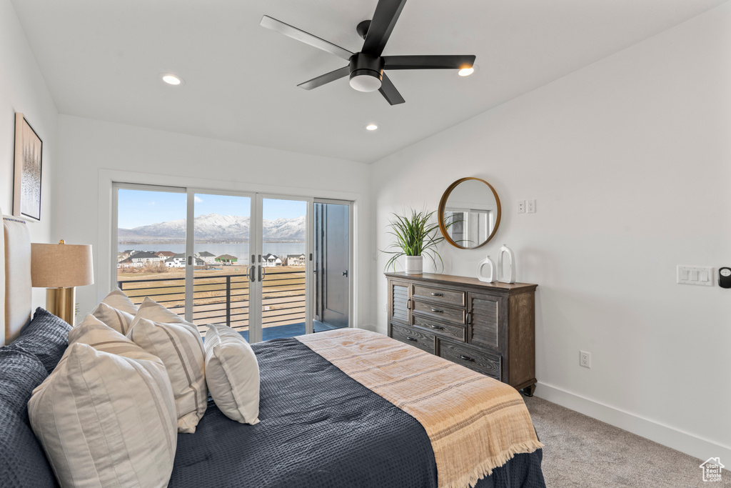 Carpeted bedroom featuring access to outside, recessed lighting, ceiling fan, and a mountain view