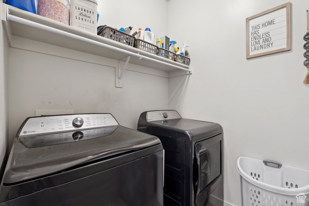 Washroom featuring washing machine and dryer