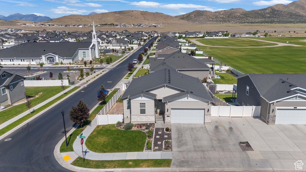 Aerial perspective of suburban area featuring a mountain backdrop