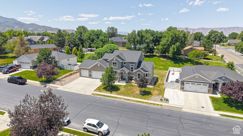 Aerial perspective of suburban area with a mountainous background