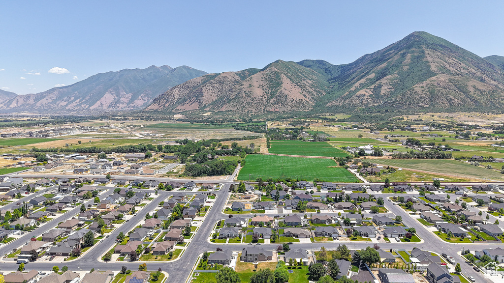 View of property location with a mountain backdrop and nearby suburban area