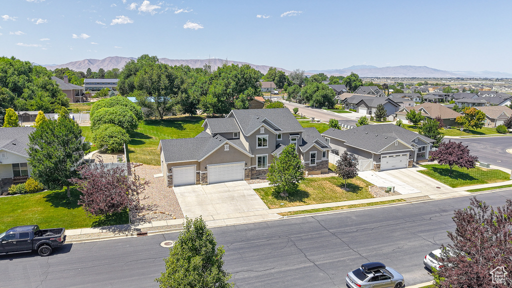 Aerial view of residential area featuring mountains
