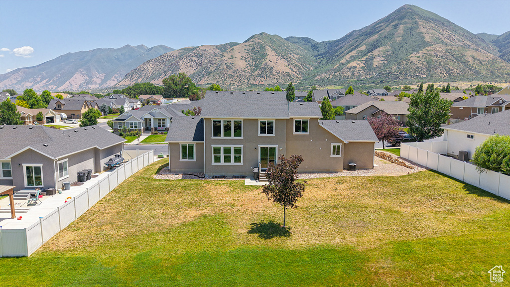 View of mountain background featuring nearby suburban area
