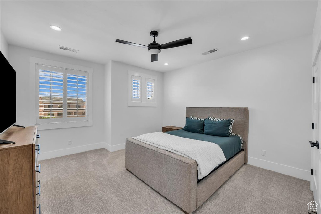 Bedroom featuring light carpet, recessed lighting, and ceiling fan