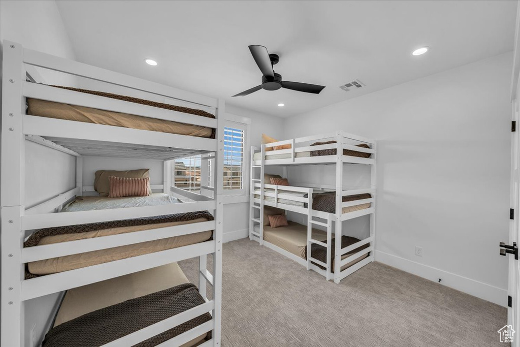 Carpeted bedroom featuring recessed lighting and ceiling fan