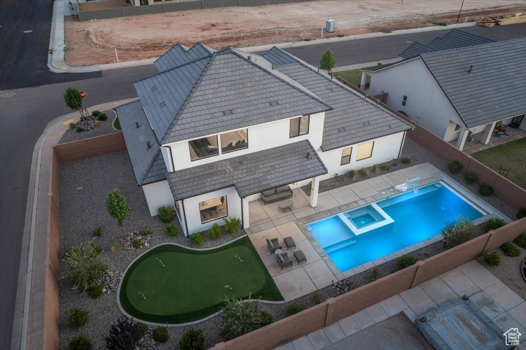 View of subject property featuring a pool area