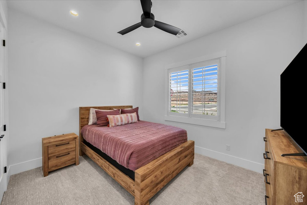 Bedroom with recessed lighting, light colored carpet, and ceiling fan