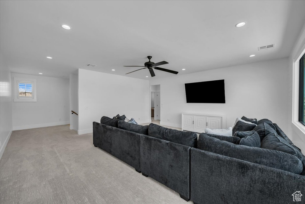 Living room featuring recessed lighting, light carpet, and ceiling fan