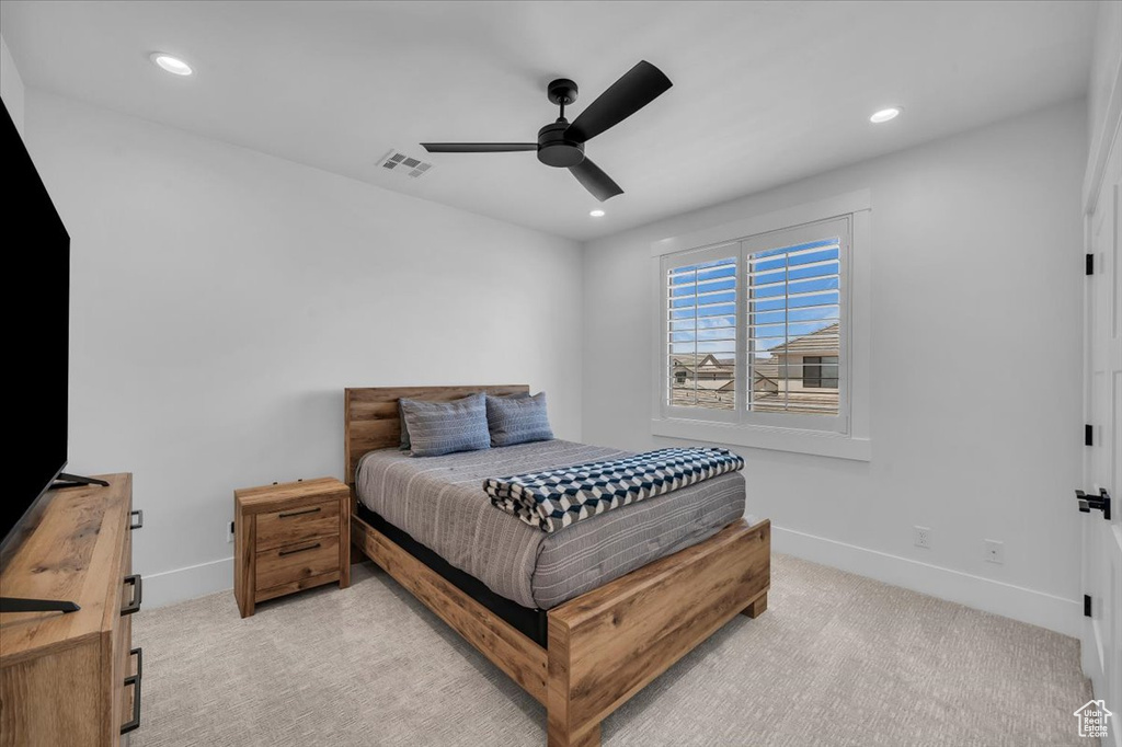 Bedroom featuring light colored carpet, recessed lighting, and ceiling fan