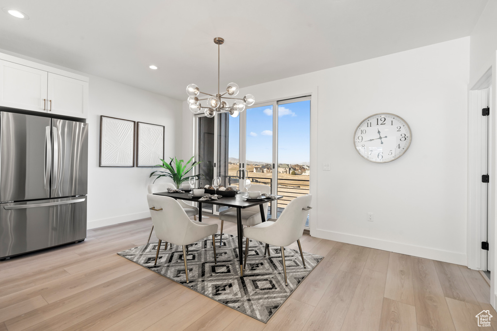 Dining room featuring recessed lighting, a chandelier, and light wood-style floors