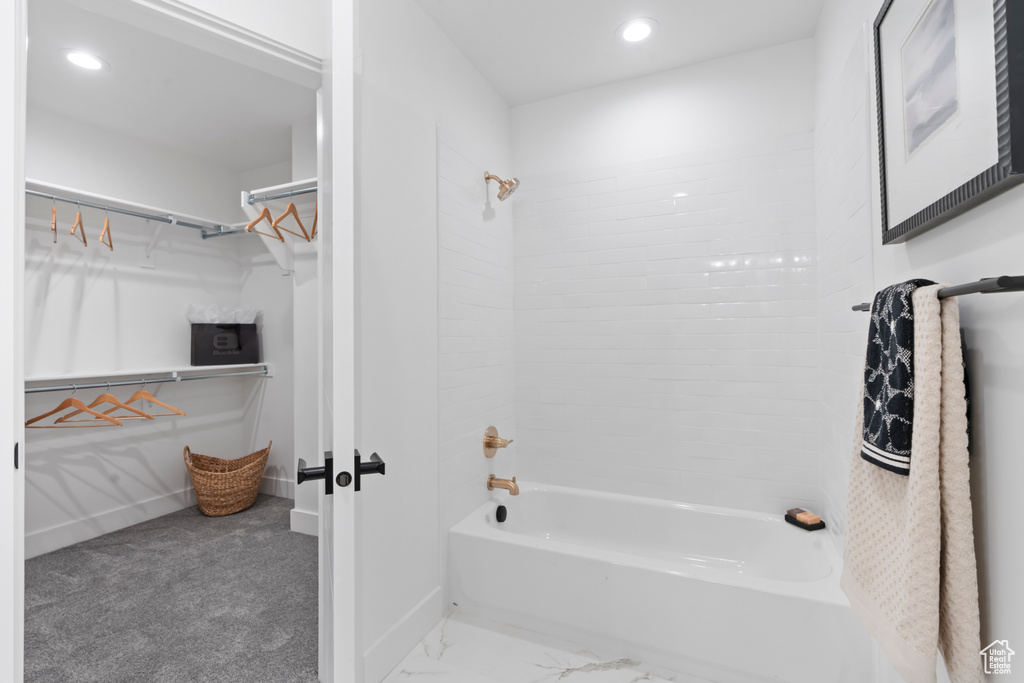 Full bath with tub / shower combination, recessed lighting, and a spacious closet