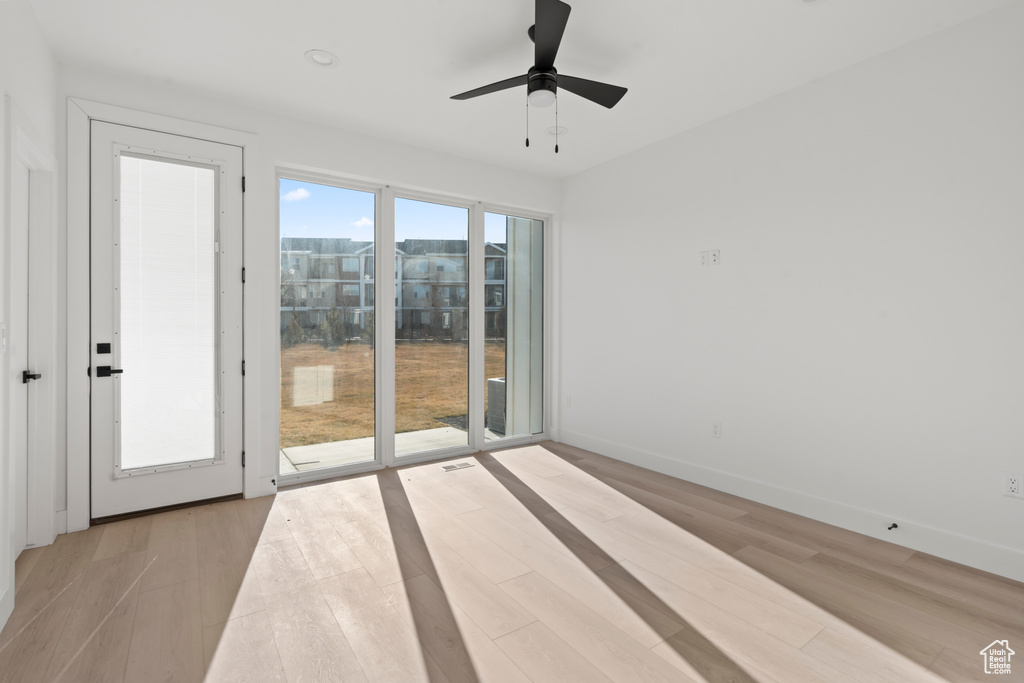 Unfurnished room featuring ceiling fan and light wood finished floors