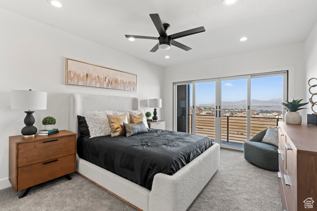 Bedroom with access to exterior, a mountain view, recessed lighting, light colored carpet, and a ceiling fan