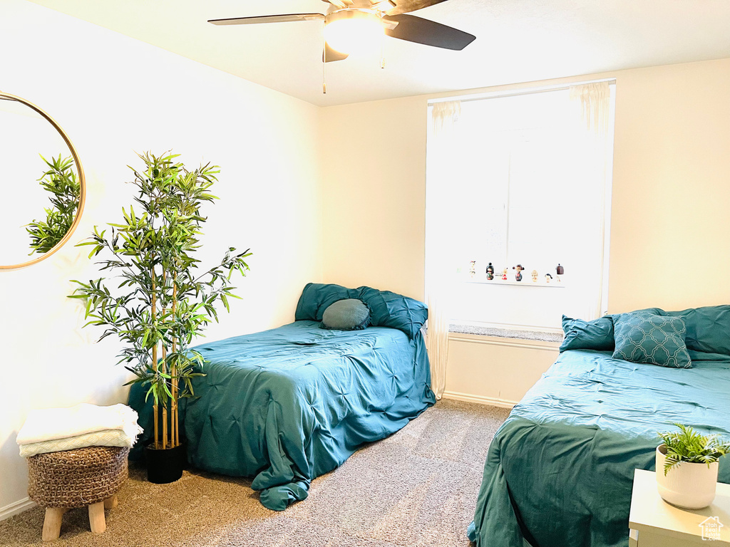 Bedroom featuring carpet floors and a ceiling fan