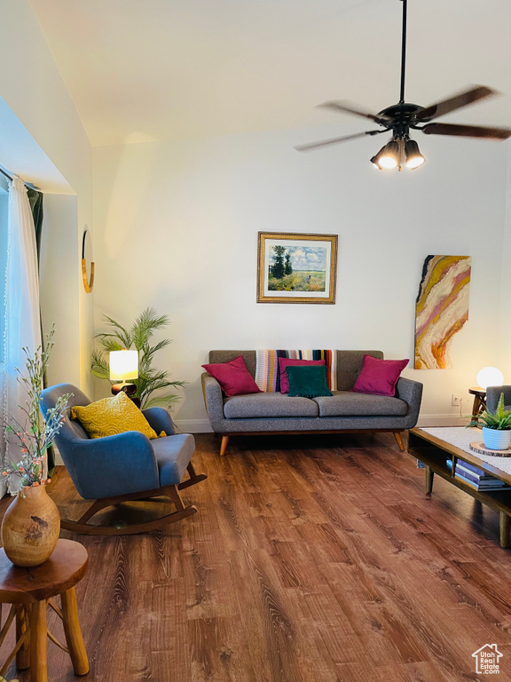 Living area featuring wood finished floors and ceiling fan