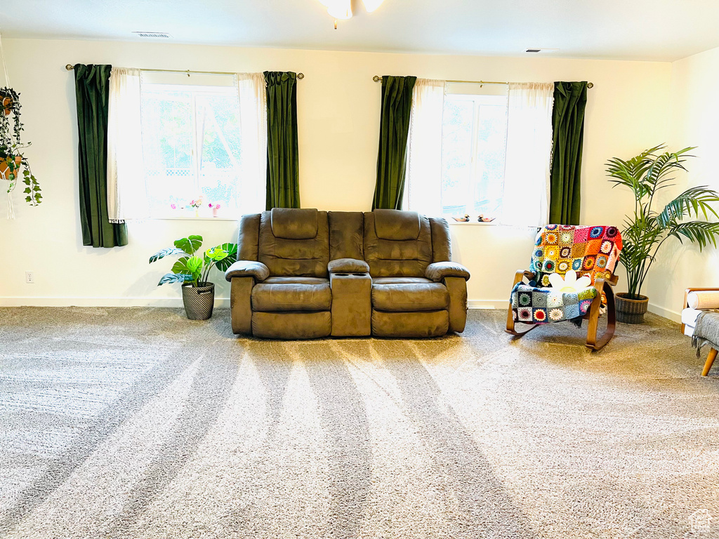 Carpeted living room with baseboards