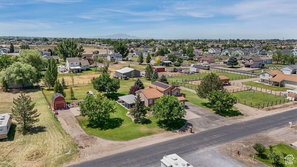 Aerial perspective of suburban area featuring a mountainous background