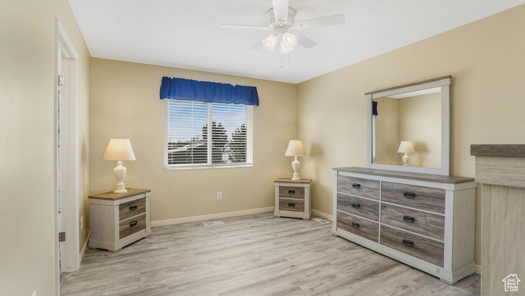 Bedroom with light wood-style flooring and ceiling fan