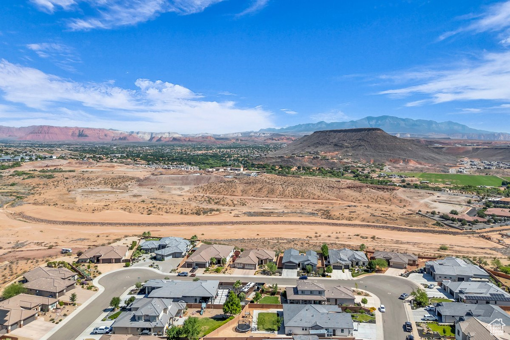 Aerial view of residential area featuring a mountain backdrop
