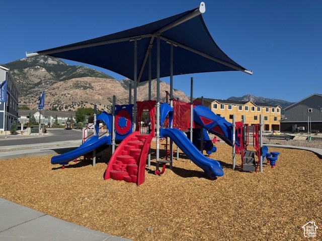 Community playground featuring a mountain view