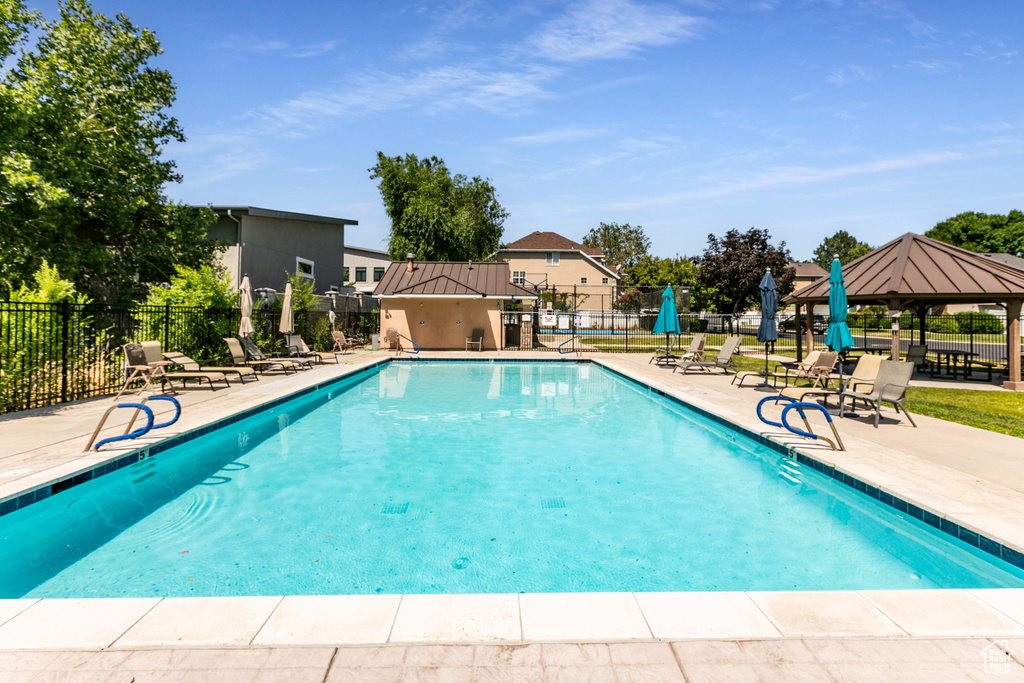 Community pool with a gazebo and a patio area