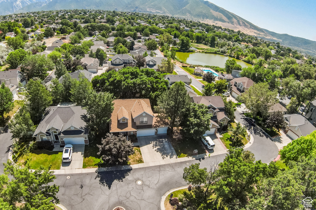 Aerial view of residential area featuring a water and mountain view