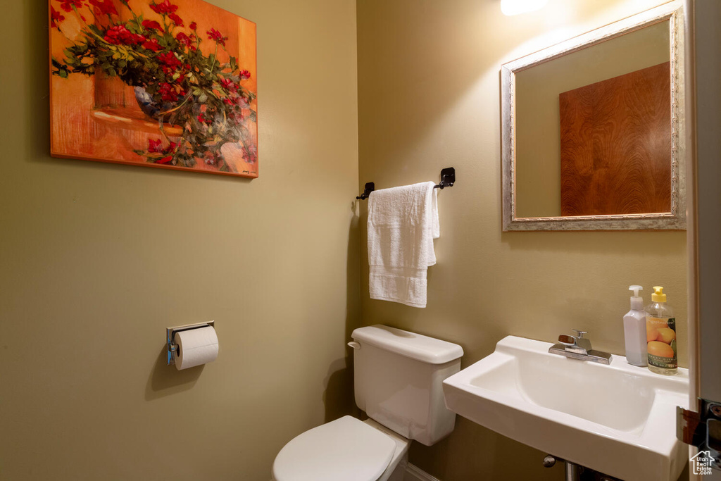 Bathroom featuring toilet and a sink