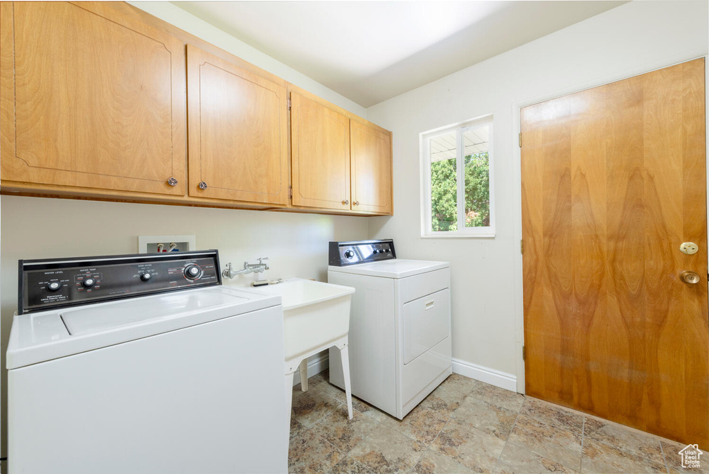 Laundry area with cabinet space and washer and dryer