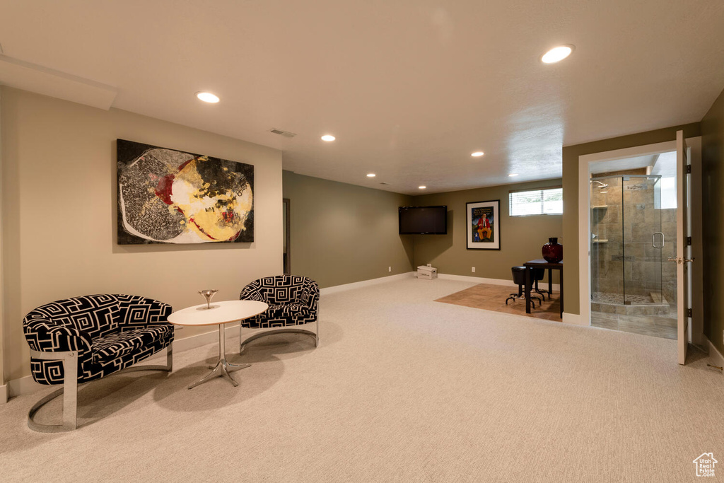 Living area with carpet flooring and recessed lighting