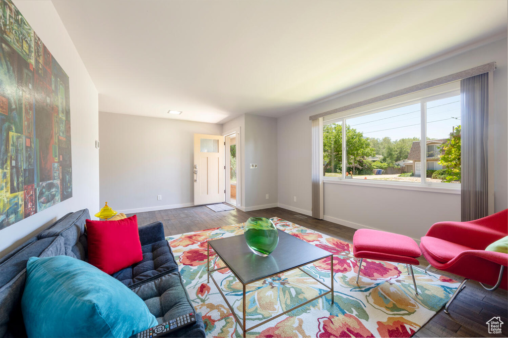 Living room featuring wood finished floors and baseboards