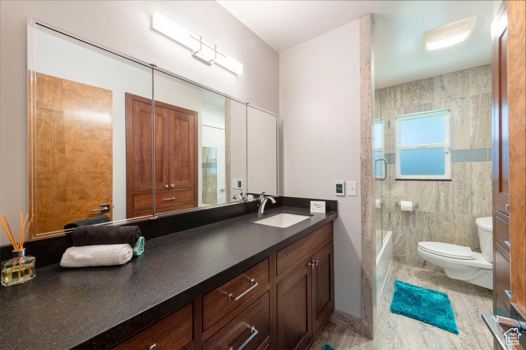 Full bathroom with vanity and washtub / shower combination