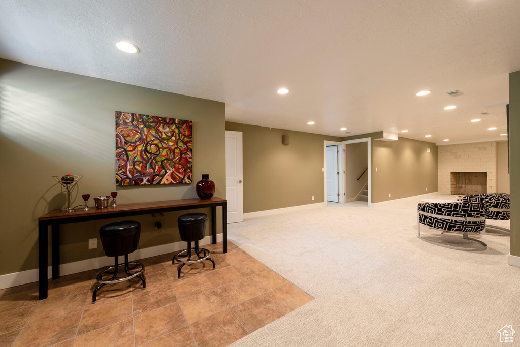 Interior space featuring recessed lighting, carpet flooring, and stairs