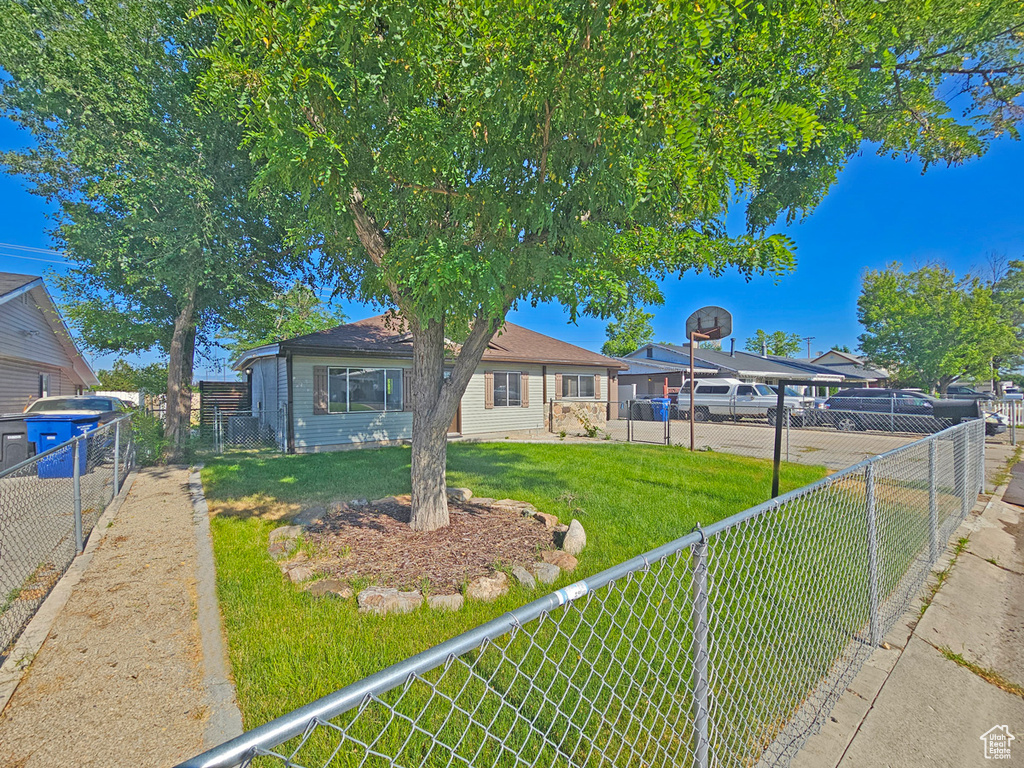 View of front facade with a fenced backyard