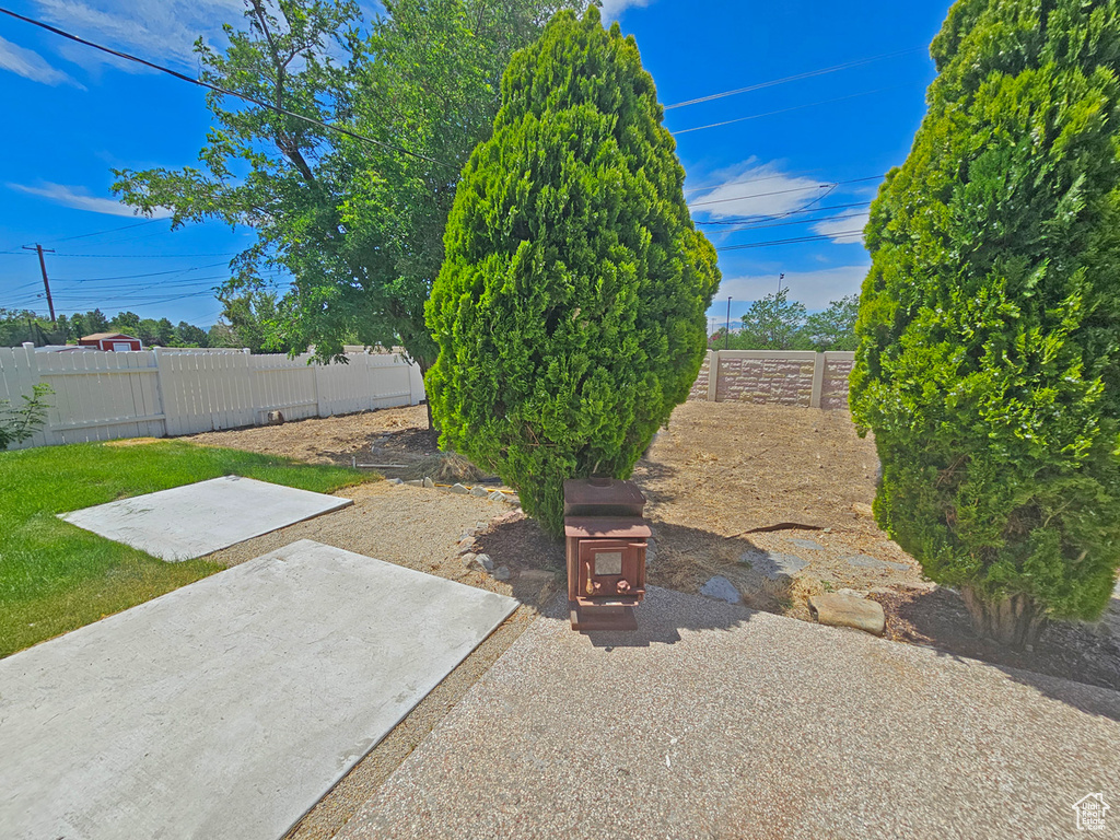 Fenced backyard with a patio