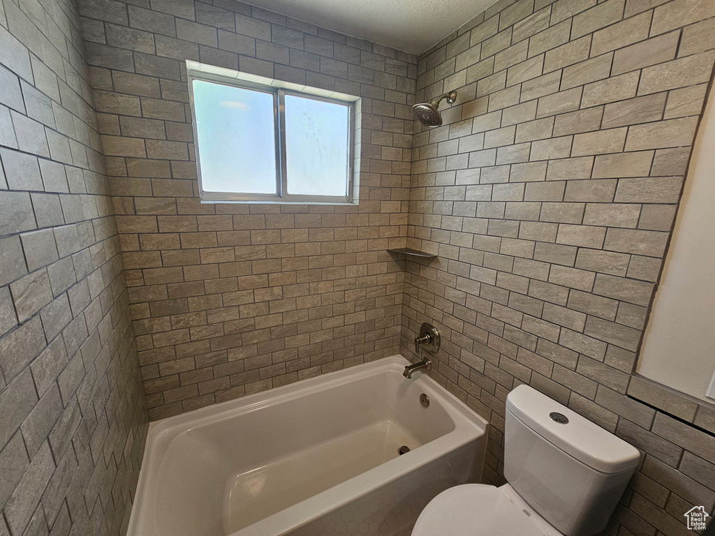 Full bath with bathtub / shower combination and toilet