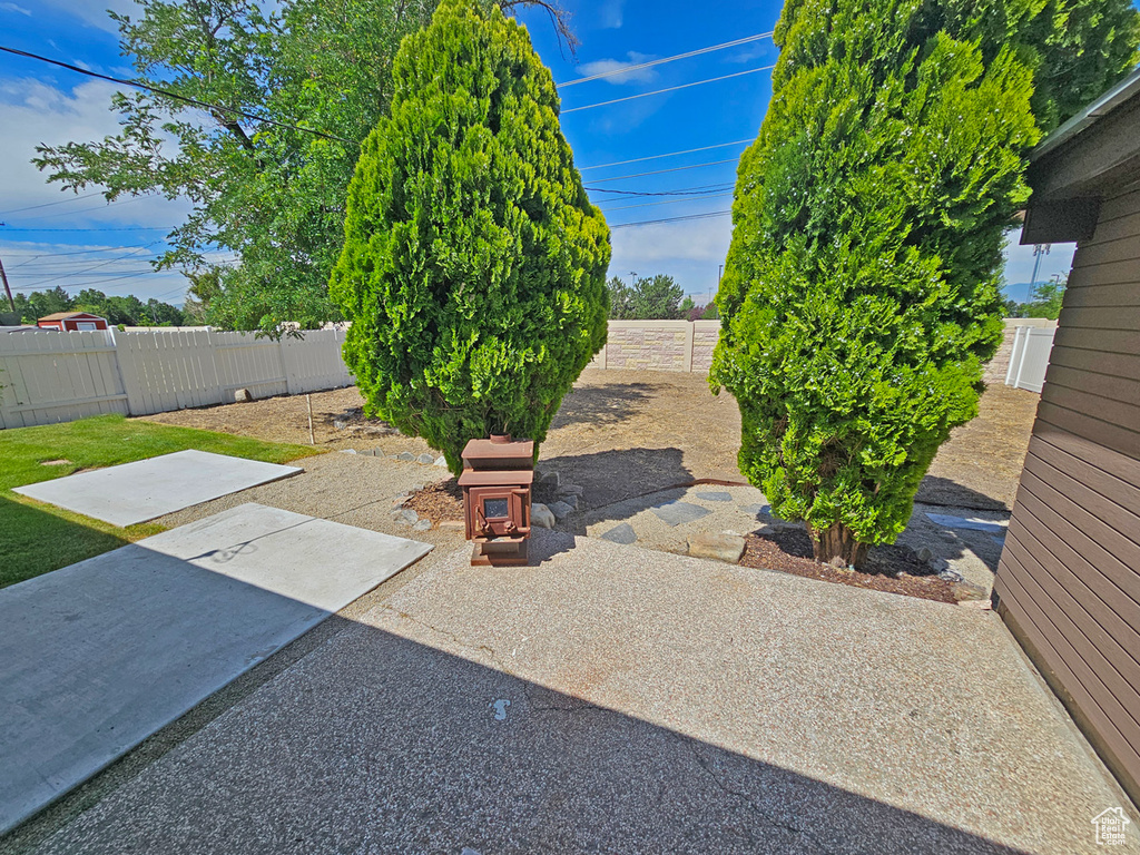 Fenced backyard with a patio