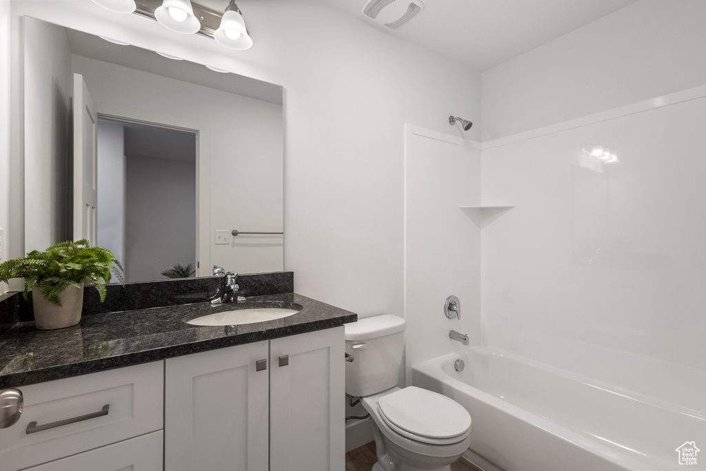 Bathroom featuring vanity and shower / washtub combination