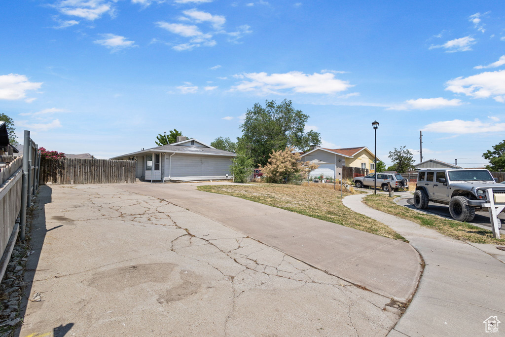 View of front of property featuring concrete driveway